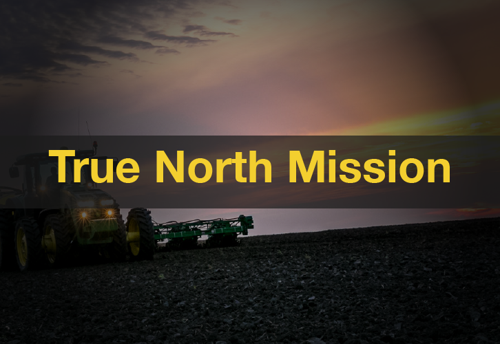 John Deere Tractor in field at sunset