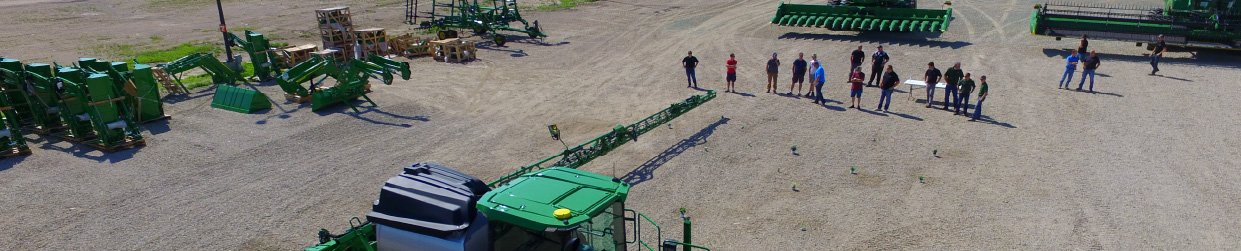 Customers watching the John Deere See and Spray Select sprayer